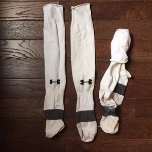 Two pairs of white under armour soccer socks